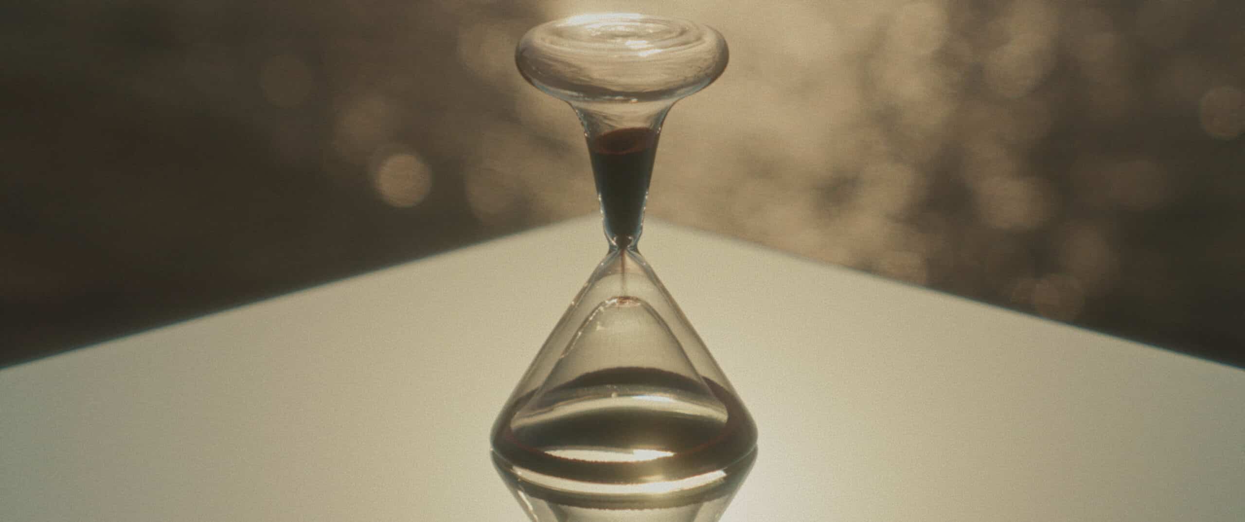 Hour glass with sand falling through